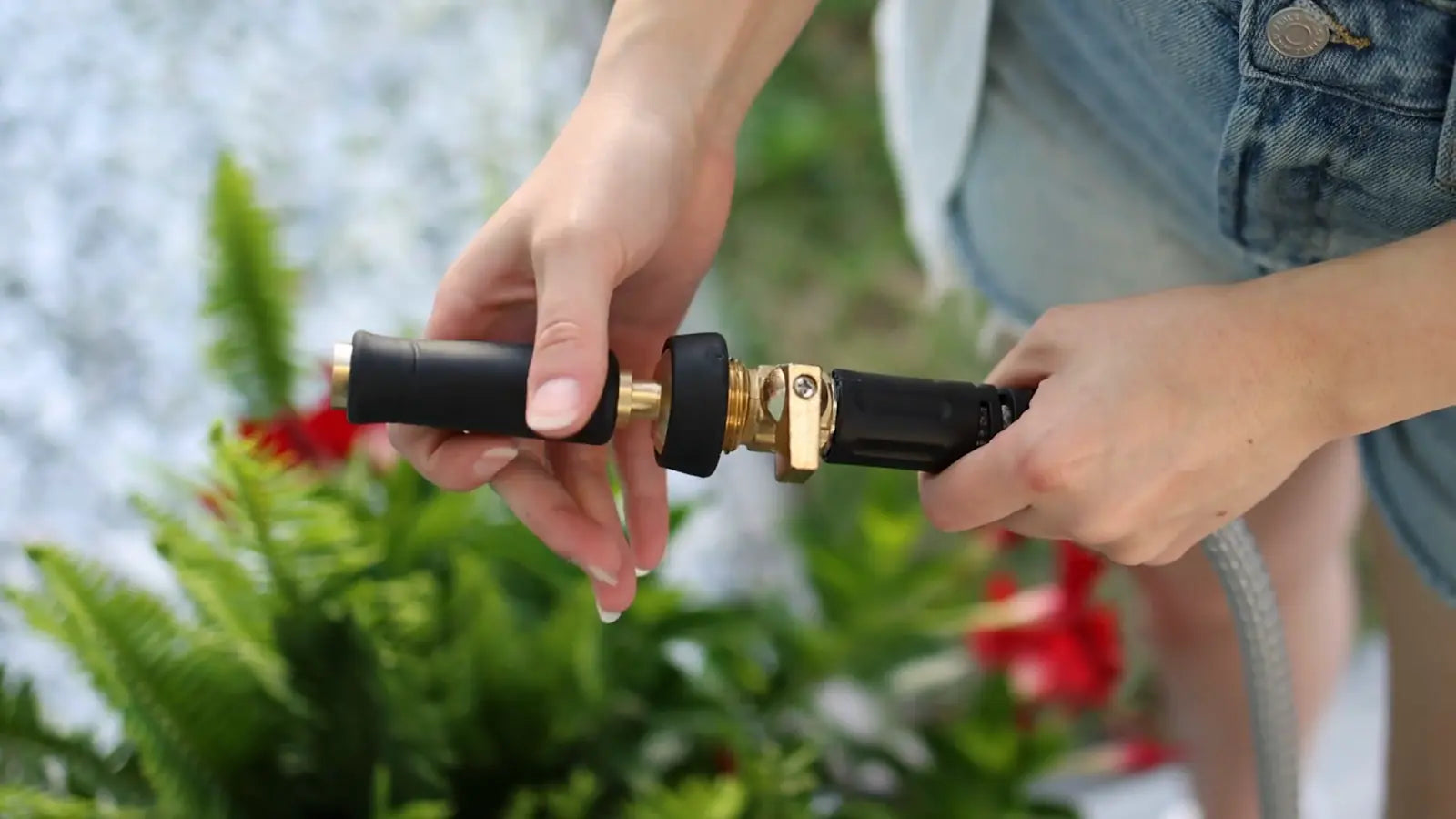 Titan adjustable nozzle watering flowers